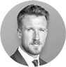Black and white portrait of a suited man.